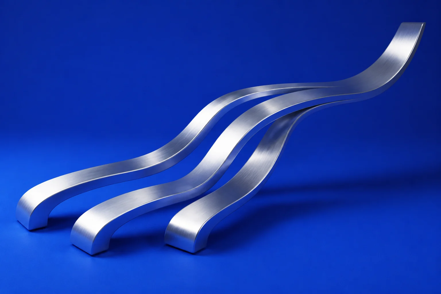 Three silver ribbons joining into a single flowing form on a deep blue background